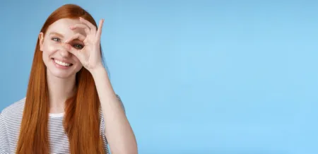 Foods And Ways to Improve Eyes Health - charismatic happy adorable redhead teenage girl sincere eyes making circle eye show okay ok sign scaled