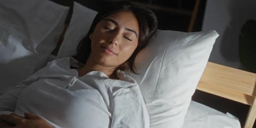 10 Sleep Aids: The Best Supplements and Herbs for Better Rest - woman sleeps